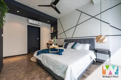 a bedroom with a large bed and a table at KLCC Expressionz by WGS in Kuala Lumpur