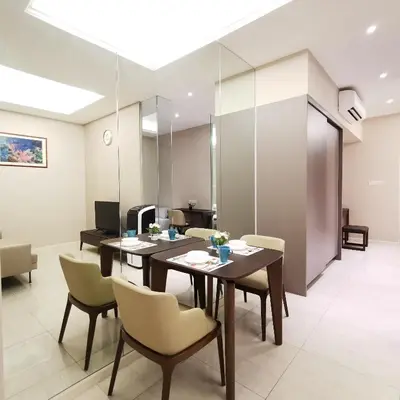 a dining room with a table and chairs at Sky Pool Elegant Suite @ Sri Hartamas in Kuala Lumpur
