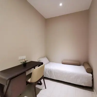 a bedroom with a desk and a bed and a desk and chair at Sky Pool Elegant Suite @ Sri Hartamas in Kuala Lumpur