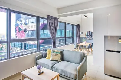 a living room with a couch and a table at Arte Plus KLCC Designer Suites by Cobnb in Kuala Lumpur