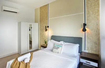 a hotel room with a bed with a sign on it at Arte Plus KLCC Designer Suites by Cobnb in Kuala Lumpur