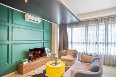 a living room with a couch and a fireplace at Arte Plus KLCC Designer Suites by Cobnb in Kuala Lumpur