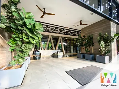 a lobby with potted plants in a building at WGS Suites at KLCC in Kuala Lumpur