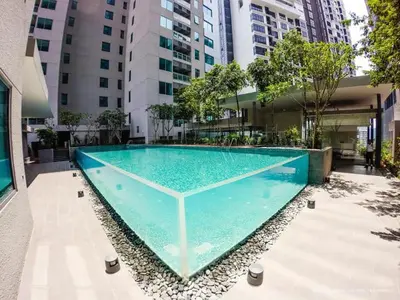 a swimming pool in the middle of a building at Amethyst KLCC in Kuala Lumpur