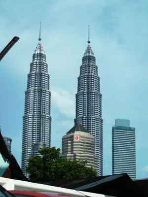 two tall skyscrapers in a city with a sky at Akar Hotel Kampung Baru in Kuala Lumpur