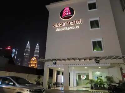 a hotel with a sign on the side of a building at Akar Hotel Kampung Baru in Kuala Lumpur