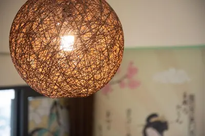 a hanging orb light fixture in a room at Kisetsu no ie, KLCC Kuala Lumpur in Kuala Lumpur