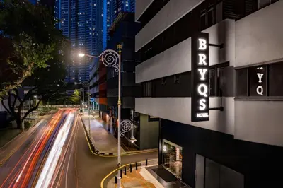 a hotel sign on the side of a building at BRYQS Hotel in Kuala Lumpur
