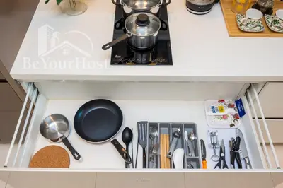 a kitchen drawer filled with lots of utensils at Dorsett Residences Sri Hartamas [5 Star Suites] in Kuala Lumpur