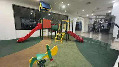 a play room with a playground with a slide at Taragon Apartment - KL ,Malaysia in Kuala Lumpur