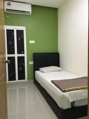a bedroom with a bed and a window with stars at Hotel 3Winz Chow Kit Kuala Lumpur in Kuala Lumpur