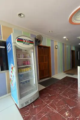 an open refrigerator in a room with colorful walls at Hotel 3Winz Chow Kit Kuala Lumpur in Kuala Lumpur