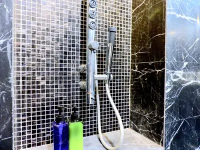 a shower in a bathroom with two extinguishment bottles at Ken Bangsar By Sleepy Bear in Kuala Lumpur