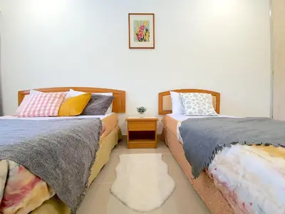 two beds sitting next to each other in a room at Kuala Lumpur Jalan Ipoh Terrace House in Kuala Lumpur