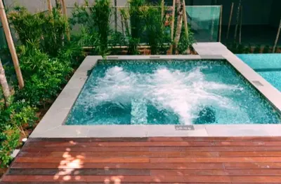 a swimming pool with water in the middle at Valencia Dorm at Mercu Summer Suites KLCC in Kuala Lumpur