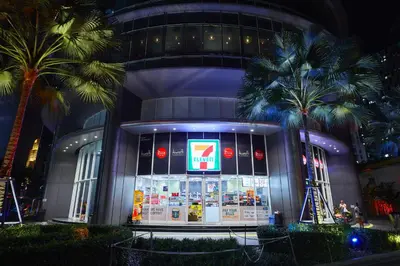 a store in front of a building with palm trees at Luxe Suites at Vortex KLCC in Kuala Lumpur