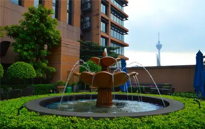 a water fountain in front of a building at Serviced Apartments at Times Square Kuala Lumpur by Robinsons in Kuala Lumpur