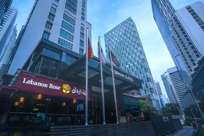 a restaurant in a city with tall buildings at Cormar Suites Kuala Lumpur in Kuala Lumpur