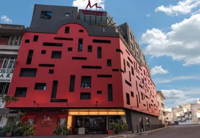 a red building with a sign on top of it at Kingston Hotel 3 - Kuala Lumpur in Kuala Lumpur