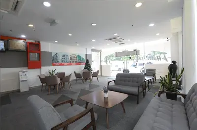a lobby with couches and chairs and a table at T-hotel Mont Kiara in Kuala Lumpur