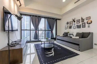 a living room with a couch and a table at Infinity KLCC Pool at M City Ampang in Kuala Lumpur