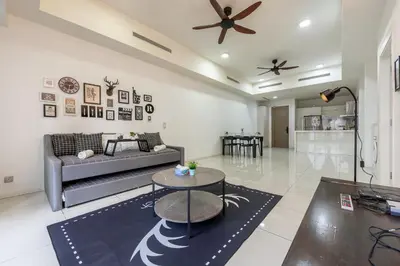 a living room with a couch and a table at Infinity KLCC Pool at M City Ampang in Kuala Lumpur