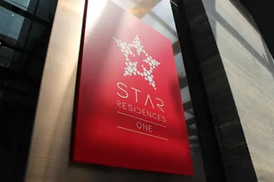 a sign in a window of a star residence at Star Suites KLCC in Kuala Lumpur