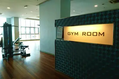 a gym room with a sign that reads gym room at KLCC Regalia Suites Infinity Pool Kuala Lumpur in Kuala Lumpur