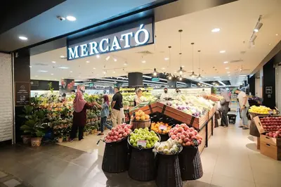 a supermarket with people standing in front of a store at Regalia Suites Infinity Pool Kuala Lumpur in Kuala Lumpur