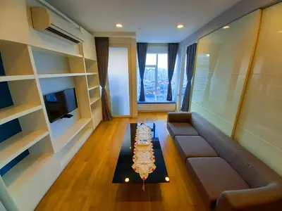 a living room with a couch and a table at Yemala Suites at Platinum KLCC in Kuala Lumpur