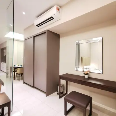 a hotel room with a mirror and a sink at Dorsett Residences Kuala Lumpur in Kuala Lumpur