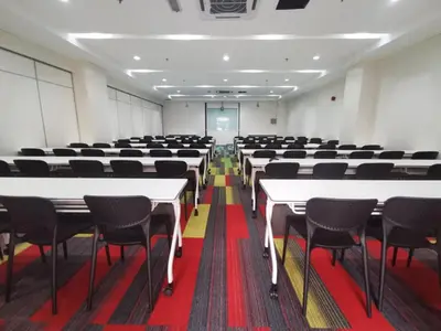 a room with rows of tables and chairs at Hotel Olympic Malaysia Kuala Lumpur in Kuala Lumpur