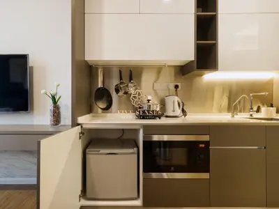 a kitchen with a sink and a stove top oven at Ceylonz Suites Kuala Lumpur, Roam in Kuala Lumpur