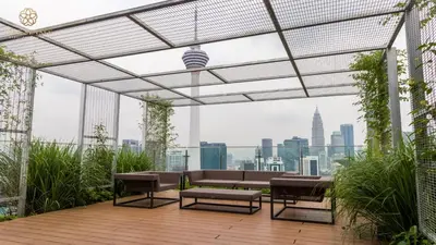 a patio with a view of the city from a building at Ceylonz Suites Kuala Lumpur, Roam in Kuala Lumpur