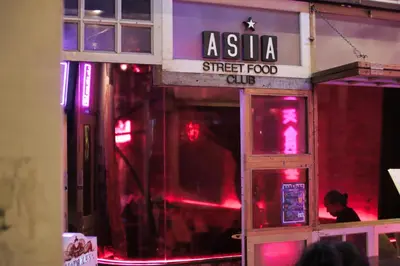 an asia street food club with red lights in a building at Rain Forest Hotel in Kuala Lumpur