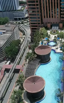 an aerial view of a resort with two pools at KL Time Square suit At Times square in Kuala Lumpur
