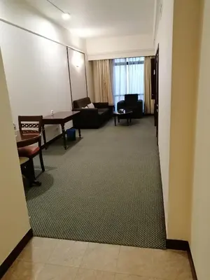 a living room with a couch and a table at KL Time Square suit At Times square in Kuala Lumpur