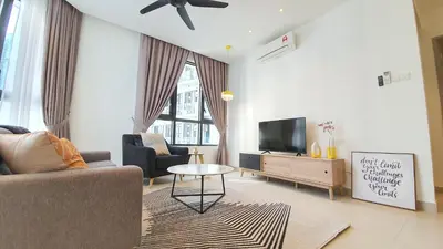 a living room with a couch and a tv at KLGateway Premium Residence Mid Valley in Kuala Lumpur