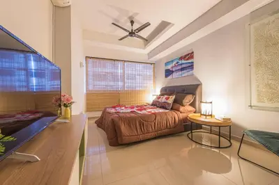 a large bedroom with a bed and a table at Fahrenheit88-Japan Theme Bukit Bintang Kuala Lumpur 2R2B 6Pax in Kuala Lumpur