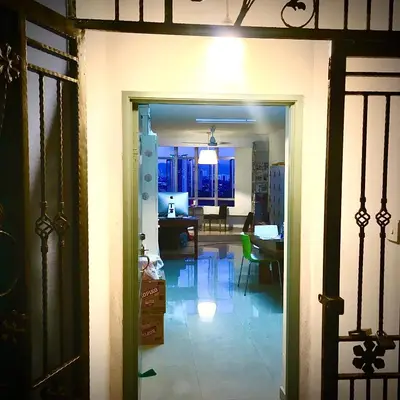 an open door to a room with a dining room at Monkey Mansion in Kuala Lumpur