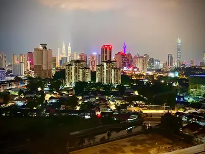 a view of a city at night with at Monkey Mansion in Kuala Lumpur