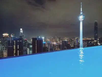 a view of the sydney city skyline at night at Luxe Suites at Platinum KLCC in Kuala Lumpur