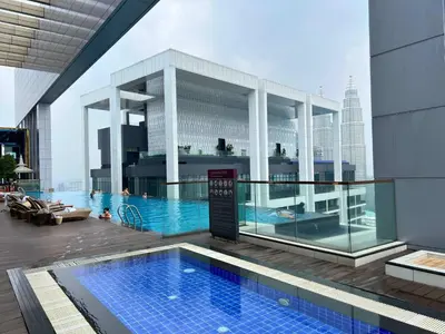 a swimming pool on the roof of a building at Luxe Suites at Platinum KLCC in Kuala Lumpur
