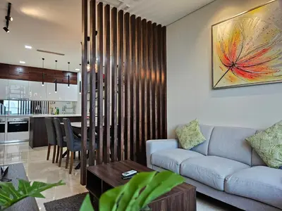 a living room with a couch and a table at Sky Suites KLCC by Asiapex in Kuala Lumpur