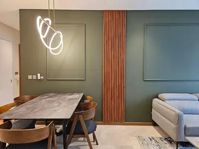 a dining room with a table and a couch at Sky Suites KLCC by Asiapex in Kuala Lumpur