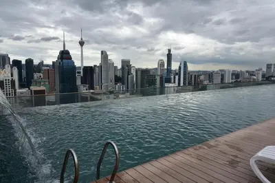 a swimming pool on top of a city skyline at Wonderful KLCC View at Regalia Suites in Kuala Lumpur