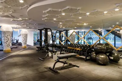 a gym with treadmills and weights in a building at Arte Mont Kiara in Kuala Lumpur