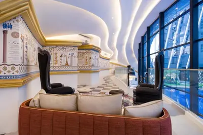 a lobby with a couch and chairs in a building at Arte Mont Kiara in Kuala Lumpur