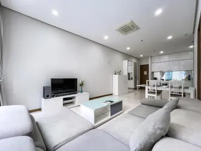 a living room with a couch and a tv at Soho Suites KLCC by Rest Kuala Lumpur in Kuala Lumpur