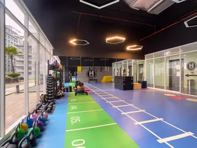 a gym with a green floor with bowling lanes at Soho Suites KLCC by Rest Kuala Lumpur in Kuala Lumpur